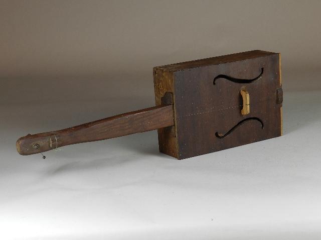 Folk Art Cigar Box One String Instrument: has two sounding holes, hand carved neck and tuning peg, loss of veneer along bottom edge, wear from use, 20" long