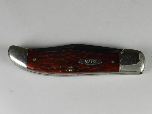 Case XX 6265 SAB Pocket Knife: with jigged red bone handles. Blades have been sharpened and show spots of pitting. Overall moderate spots of wear. 5 1/4" long closed