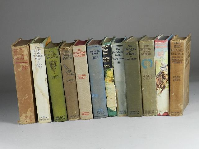 12 Zane Grey Hard Back Books: well used condition
