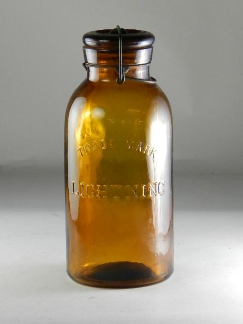 Trademark Lightning Half Gallon Amber Jar: RB# 1489, type 3 lid, minor wear, has large mold flaw on back side, 9 3/4" h