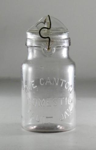 The Canton Domestic Fruit Jar Quart Clear Jar: RB# 565, correct 1889 dated closure. Closure heavily rusted, small chips to ground lid, small Fish Eye on shoulder above wording, 7" h
