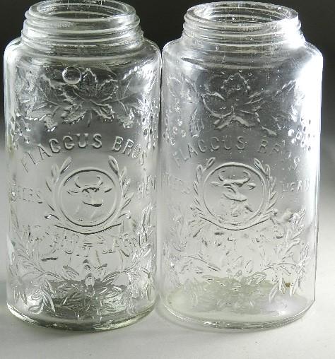 Lot of 2 Flacous Bros Steers Head Fruit Jars: pint clear jar, RB#1014. Both smooth lip with minor chips, 6" h