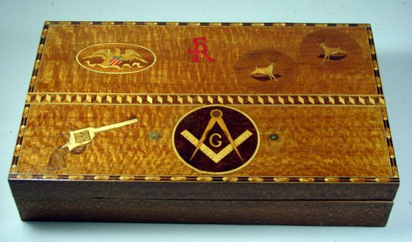Folk Art Inlaid Wood Box: Lid is inlaid with federal eagle, two running deer, revolver, masonic emblem and initals SR as well as decorative border. Box is plain on interior. 17" w x 10" d x 3 1/2" h.