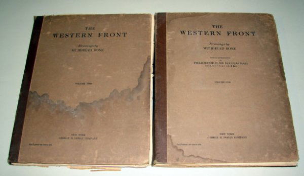 The Western Fron Drawings by Muirhead Bone in Two: Complete individual magazines in hard folders. Second volumn cover has water damage. Corner bumps and frayed edges. Contains many prints suitable for framing. 12 1/2" h x 10" w.