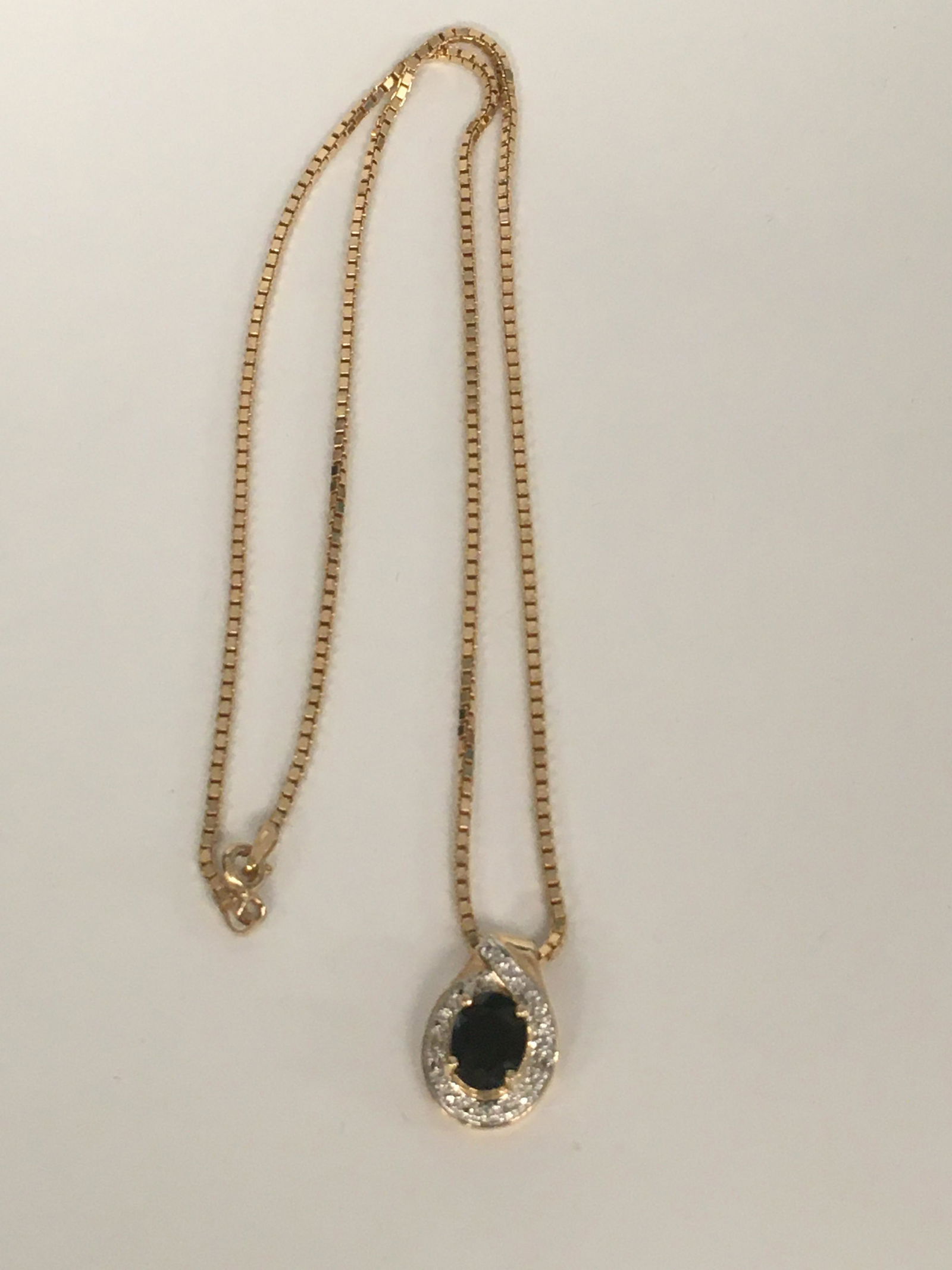 Sterling Gold Toned Blue Stoned Pendant Necklace: necklace is approximately 17", pendant is 3/4" h