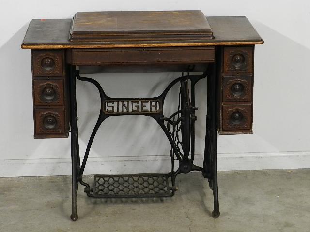 Singer Treadle Sewing Machine: damage to veneer and wear to paint on machine, 30" h x 37" w x 18" d