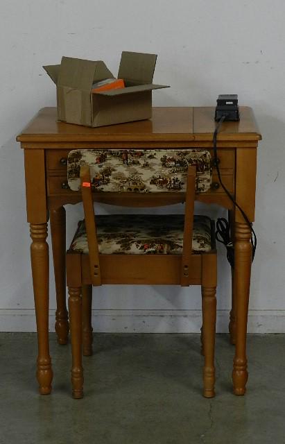 Singer Sewing Machine: in maple cabinet