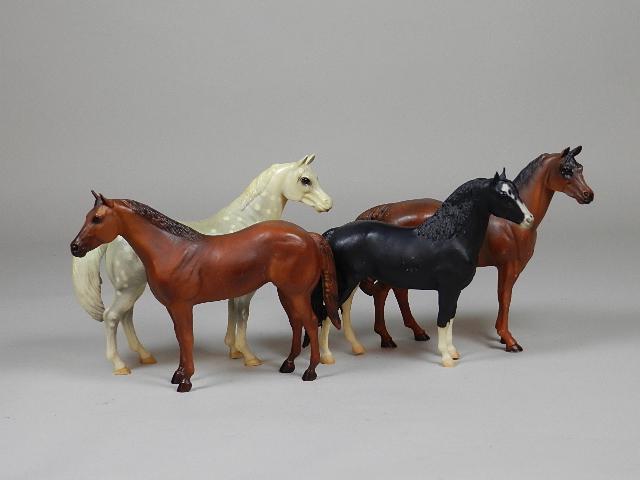 Four Plastic Horses: one is Breyer, 8 1/2" h x 11" w
