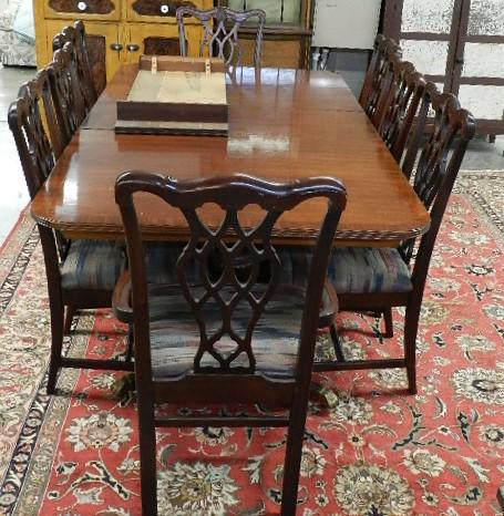 Mahogany Dining Table & 8 Chairs: Duncan Phyfe pedestal base and 8 Chippendale style chairs, comes with 2 leaves, light wear to finish, table measures 29" h x 68" w x 44" d without leaves, leaves are 16" wide