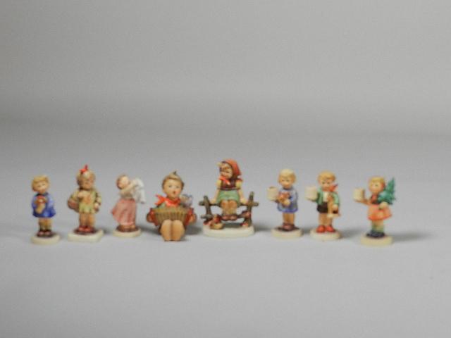 8 Goebel Hummels: 3 Candle Holders, Girl with Nosegay,: trademark 5,6, crazing on base, tallest 4: