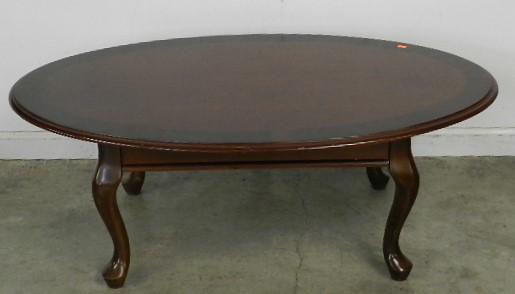 Oval Mahogany Coffee Table: wear to finish, 16" h x 44" w x 26" d