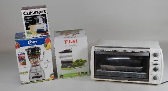 Group of Small Kitchen Appliances: Oster blender, T-Fal food steamer, Cuisinart mini food processer. All in original boxes, Black & Decker counter top oven, all untested