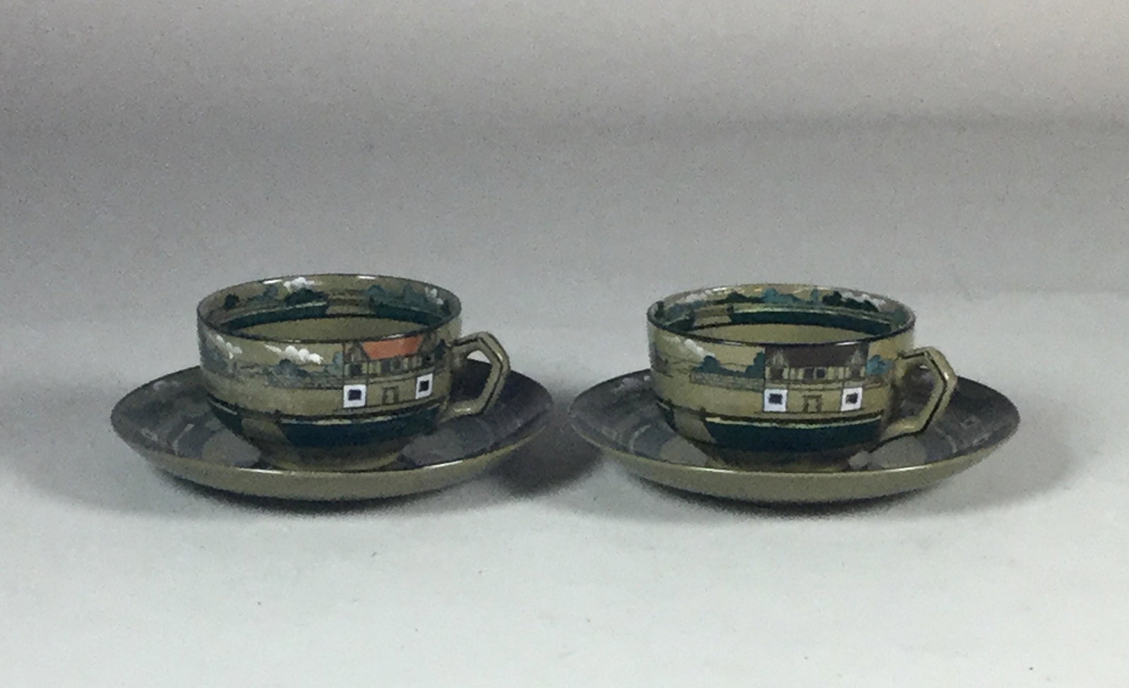 Pair of Deldare Buffalo Pottery Cups & Saucers: Pair of Deldare Buffalo Pottery Cups & Saucers