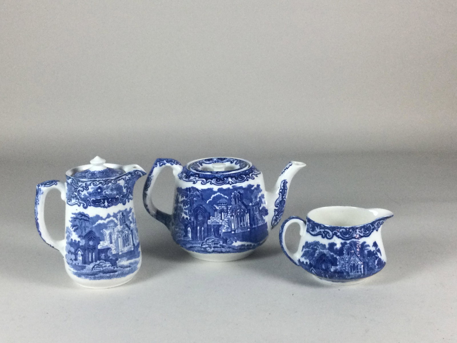 3 Piece George Jones & Sons Abbey 1790 Tea Service: coffee, tea & creamer, teapot has inner rim chip