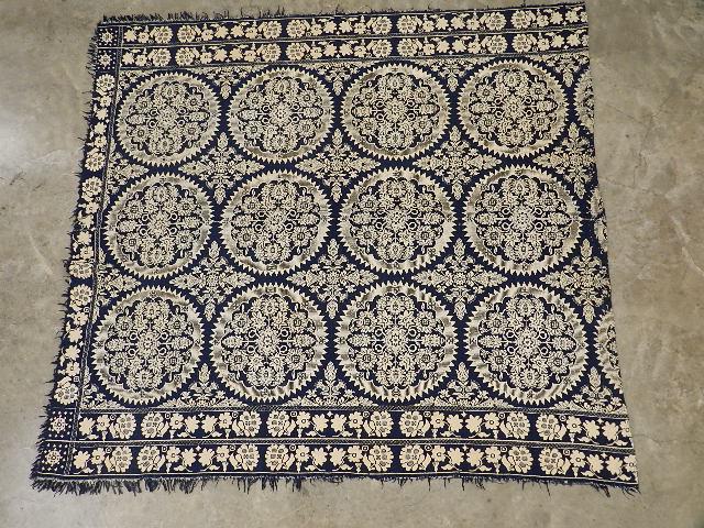 Antique Blue and White Coverlet: one edge folded over and sewn, minor stains and small areas of wear, 71" w x 77" l