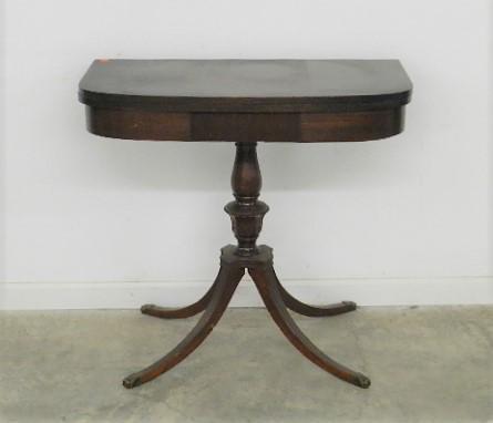 Mersman Mahogany Duncan Phyfe Style Game Table: with rotating top and hidden storage. Heavy wear/scratches to finish. Has label on bottom. Closed: 29" h x 32" w x 16" d, 32" d open