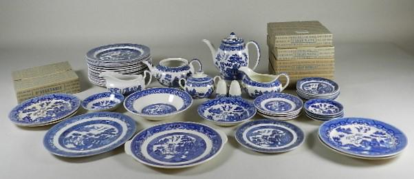 56 Pieces Blue Willow China by Various Makers: some pieces in original boxes, older pieces show wear, coffee pot: 8" h