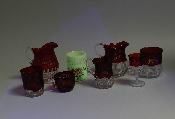 Eight EAPG Worlds Fair Souvenir Cups: some have wear to flashing or paint, largest: 5" h x 4 1/2" w