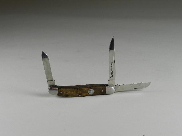 Winchester 3 Blade Pocket Knife: figural wood handles, minor wear, 3 1/2" long closed