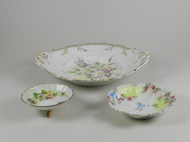 3 Pieces of Porcelain: two hand painted - flooted bowl & petal shaped plate. The petal bowl has hairline cracks, largest: 6" w. the other is a KPM transfer decorated shallow bowl, minor wear to gilt, 12" w