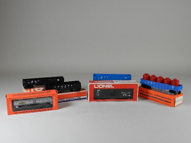 6 Lionel Cars w/boxes: 2 6162,6415,6602,9701,6032. All are very good to excellent. Boxes are very good. 6032 has broken flap. Several have foxing.