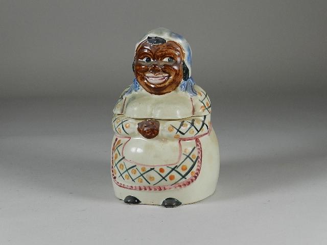 Black Americana Porcelain Cookie Jar: Small chips in lid. Glaze has crazing throughout. Marked Japan. 6? w x 10? t