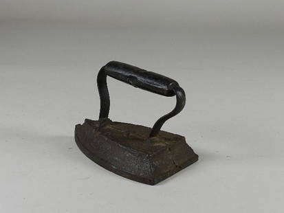 Sad Iron: Wear from use and pitting. 6 1/2" long