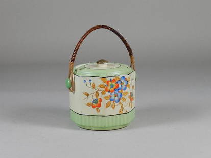 Vintage Cracker Jar with Wicker Handle: Marked Japan. Minor wear. 6"t