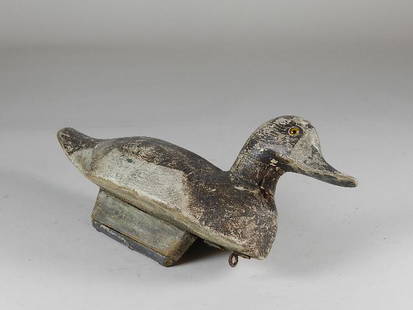 Antique Duck Decoy: Has lead weight on bottom. Glass eyes. Heavy wear to paint. 16" long