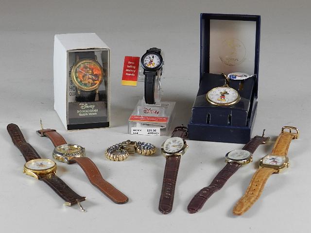 Group of Watches: Includes several different Mickey Mouse watches and a pocket watch. Wear from use.