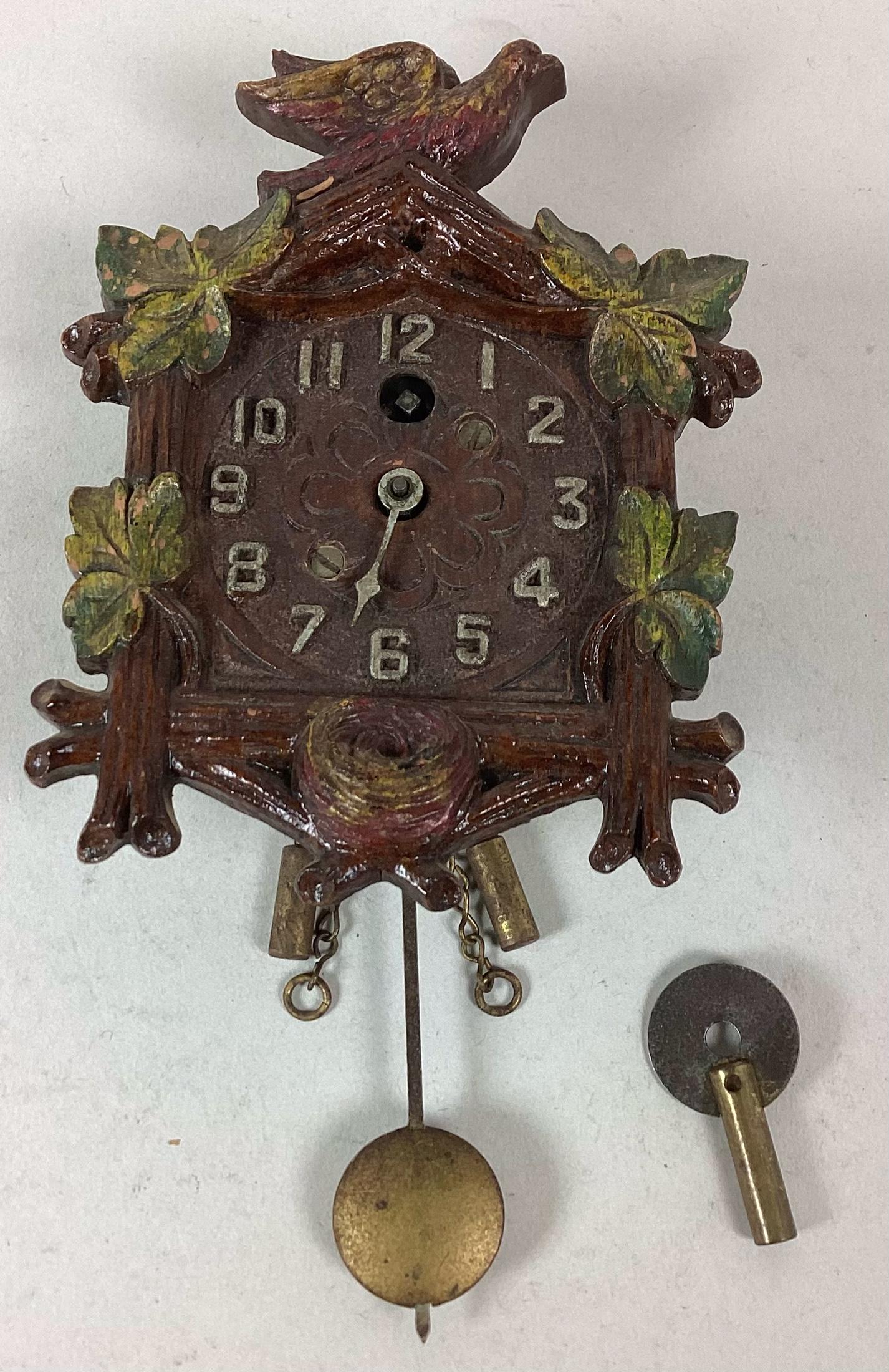 Keebler Clock Co Miniature Wall Clock: Has key. Does not run. Wear to paint. 4 3/4" tall