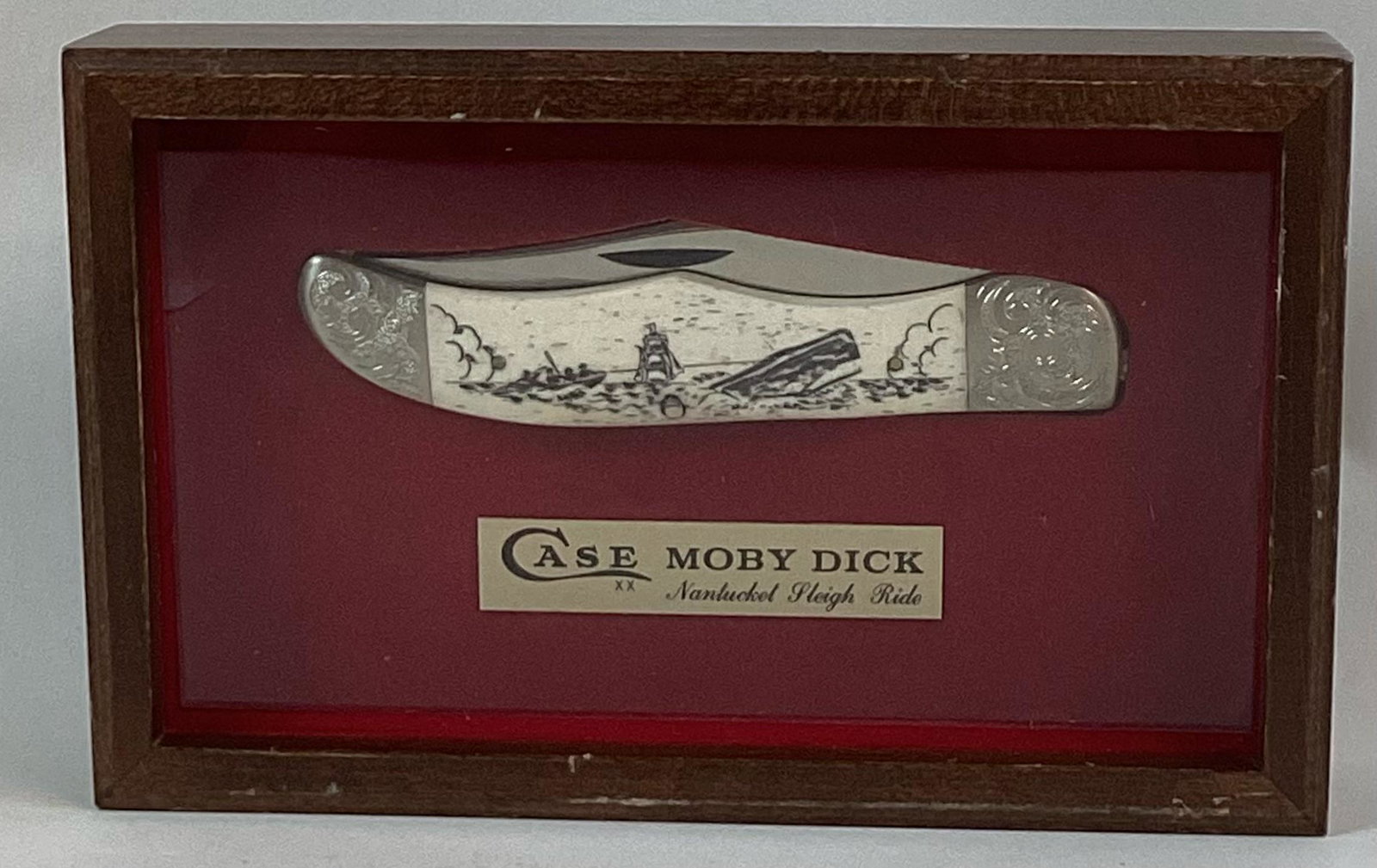 Case XX W165 SAB SSP Nantucket Sleigh Ride Scrimshaw Pocket Knife: Serial # 5424 of 7500. Real scrimshaw on bone of a whaling scene. Engraved bolsters. In display box with COA on back. Wear to box. 5? closed.