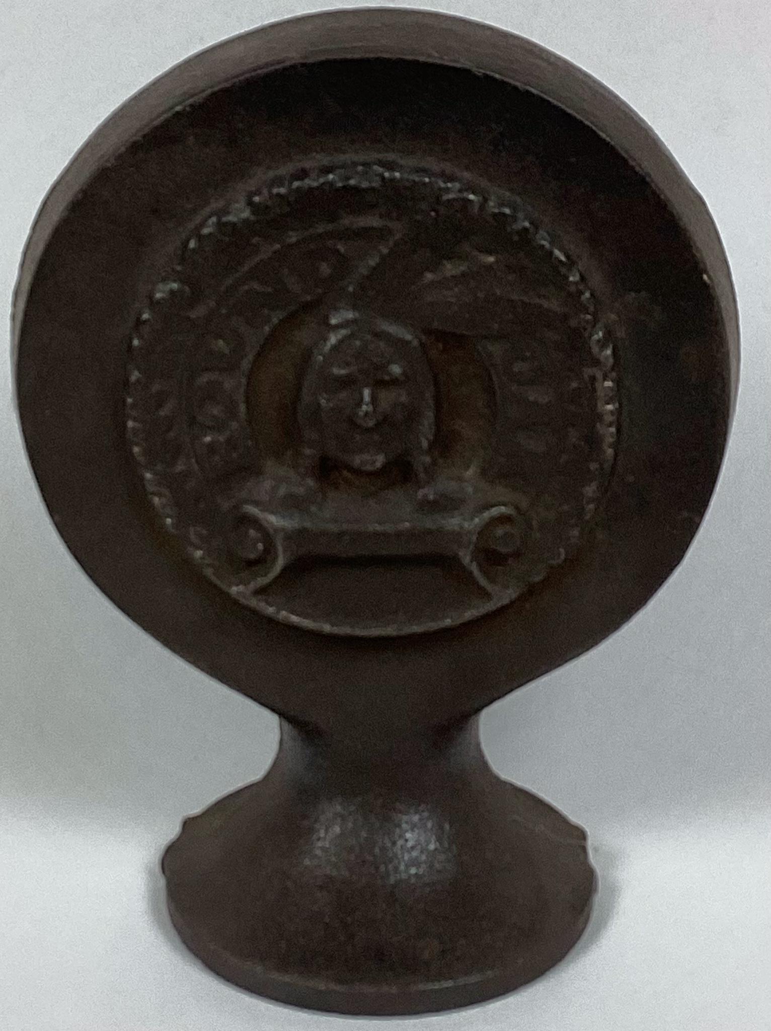 Round Oak Cast Iron Cook Stove Topper: Has name and image of Native American. Wear and pitting throughout. 6 1/2? tall