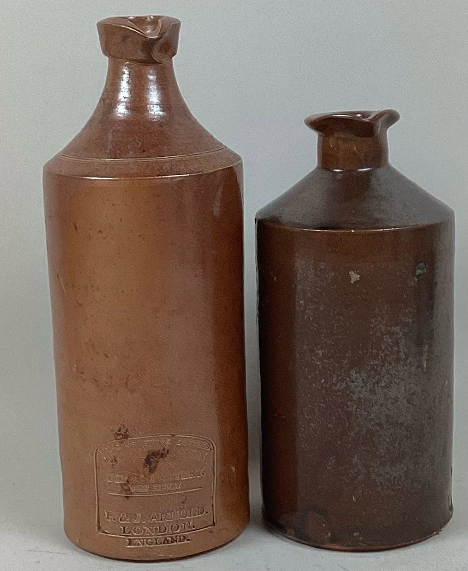 Two English Stoneware Ink Bottles: One is marker marked. Minor wear. Tallest 9 1/2?