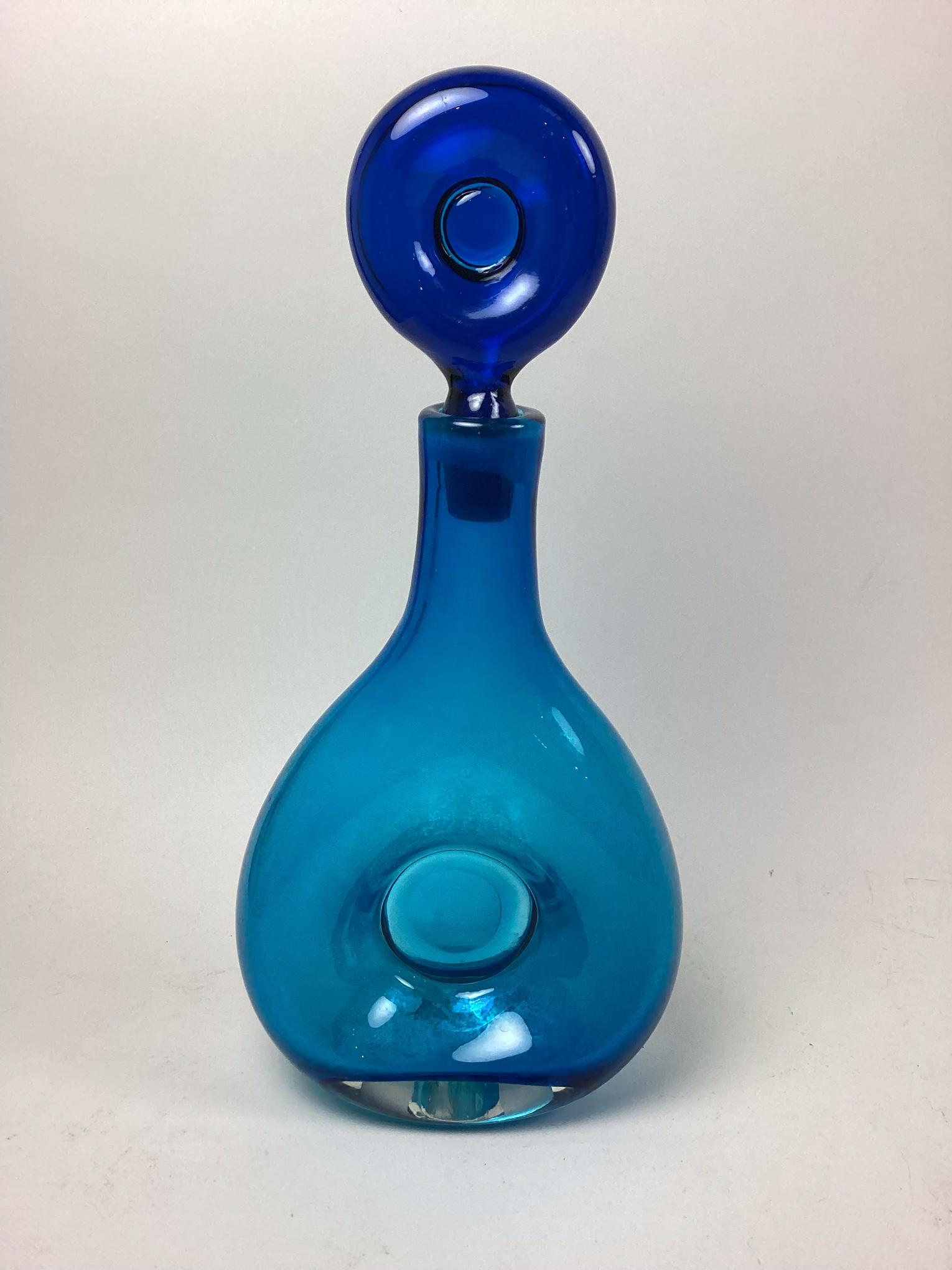 Blenko Blue Decanter: Has open pontil on bottom. Interior has water stains. Minor wear and scratches. 14" tall