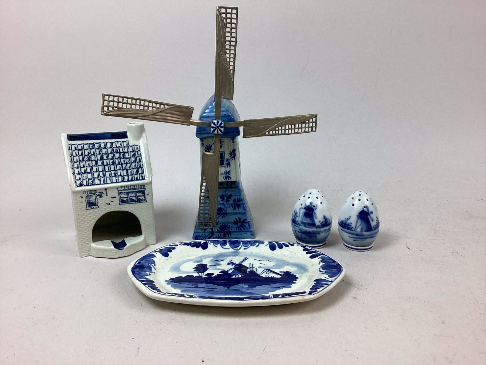 Group of Delft Porcelain Items: Includes ashtray, windmill, tray, and shakers. Minor wear. Tallest 8"