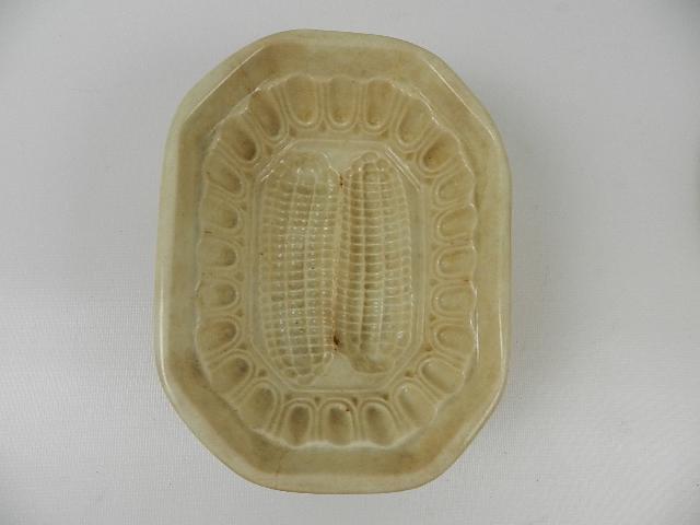 Ironstone Mold with Corn Design: Brown stains under glaze. 6 3/4" long