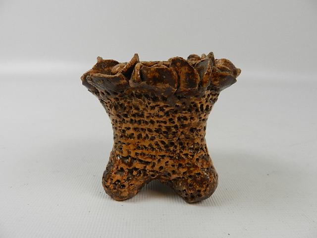 Unusual Redware Candle Holder: Has small flowers around the rim. Wear and some flowers are broken. 2 1/2" tall