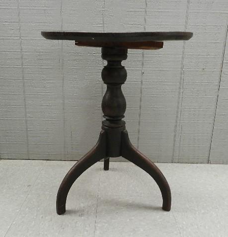 Early Candlestand: old surface with 3 spider shaped legs dovetailed into the center base. Later nail added to tighten the top shows through the top of post with several small old surface chips. Beveled round top, non ti