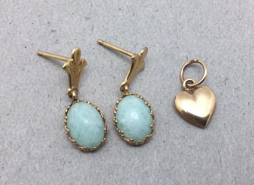 14k Gold Jewelry: Very small heart charm. Small dangle earrings with blue stones. Gold content tested. Missing backs. Good condition.
