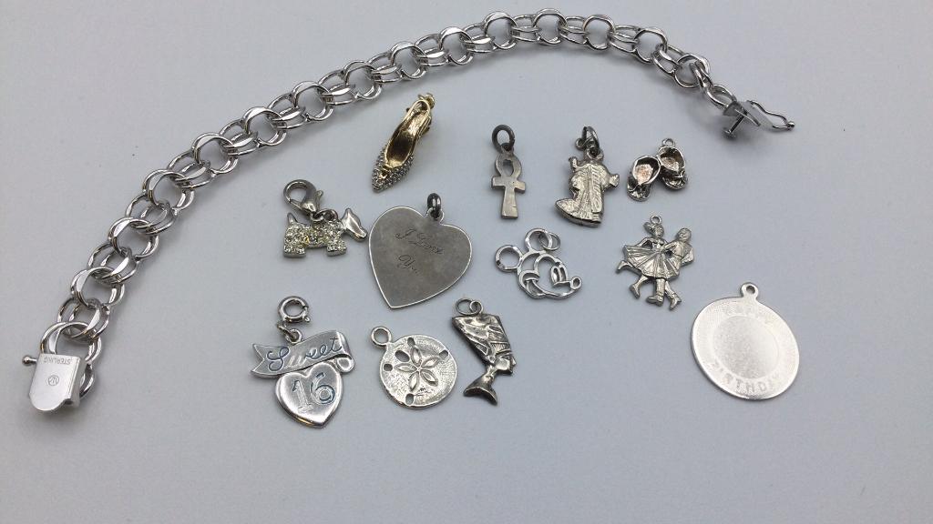 Sterling Charm Bracelet: 7.5 inch bracelet. Charms include Mickey Mouse head cutout , dancing couple, high heeled shoe, Sweet 16, and more. Not all guaranteed to be sterling. Good condition.