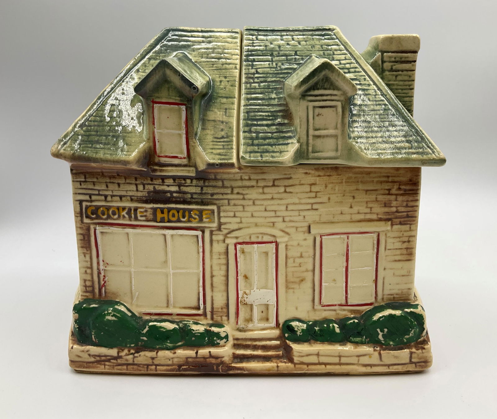 McCoy Cookie House Jar: Produced in 1958. Marked McCoy. Good condition with minor paint loss. 8 inches wide.