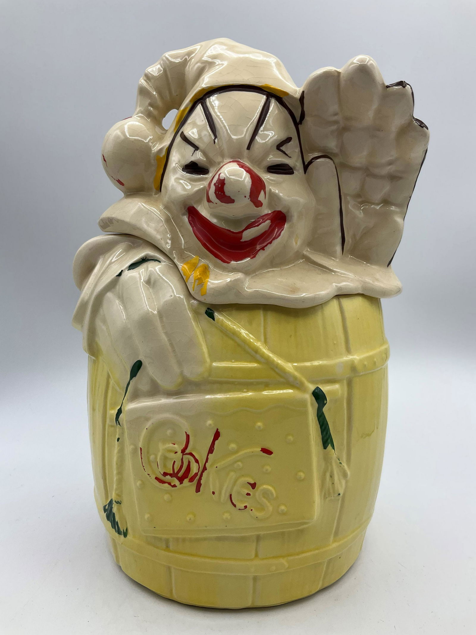 McCoy Clown in Barrel Cookie Jar: Marked McCoy USA. From 1953. Paint loss and crazing. 11 inches tall.