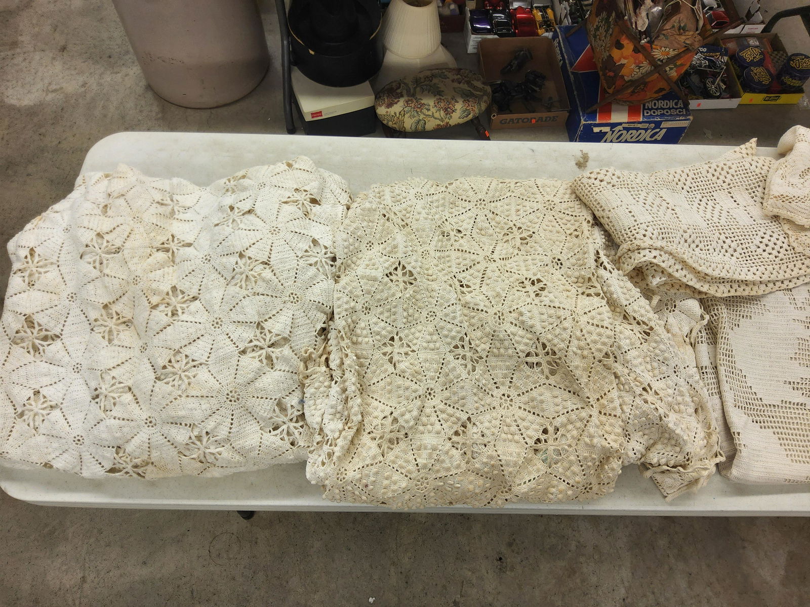 Group of Eight Blankets and Tablecloths, Knitted and Crotcheted: Discoloration, two are popcorn, variety of sizes