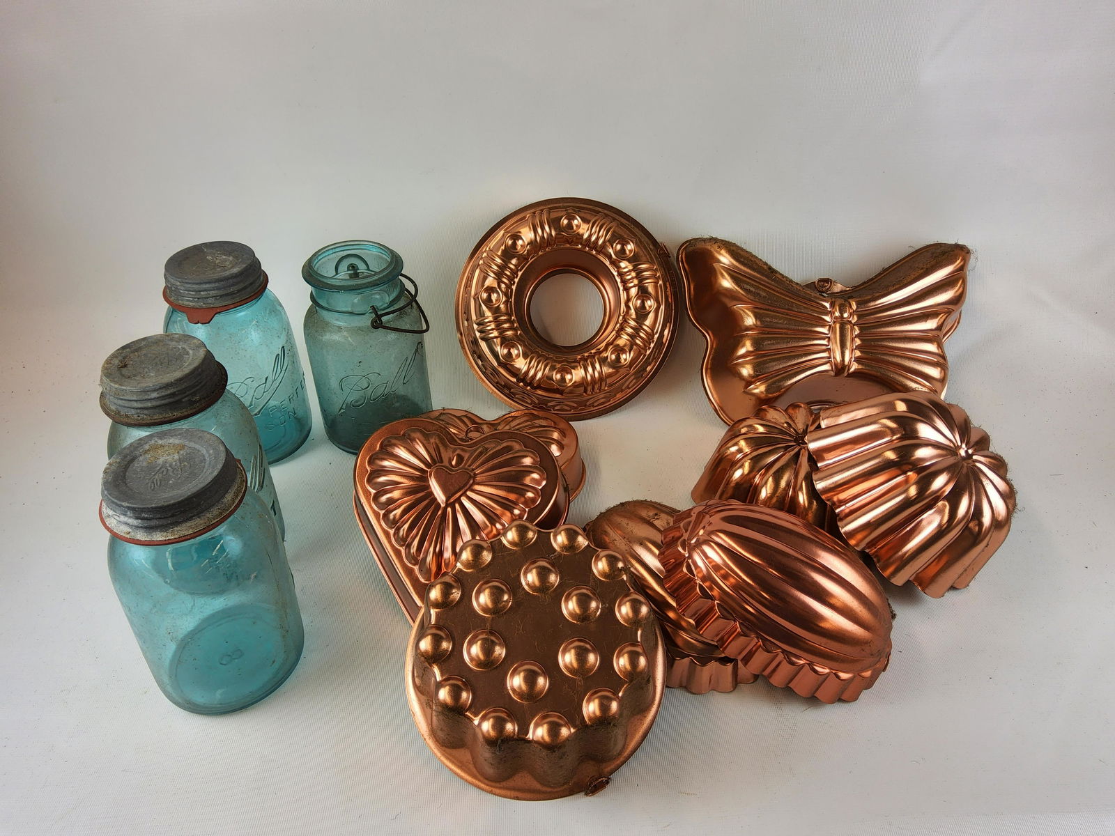 Group of Metal Copper Kitchen Molds and Four Blue Quart Jars (1 of 1)