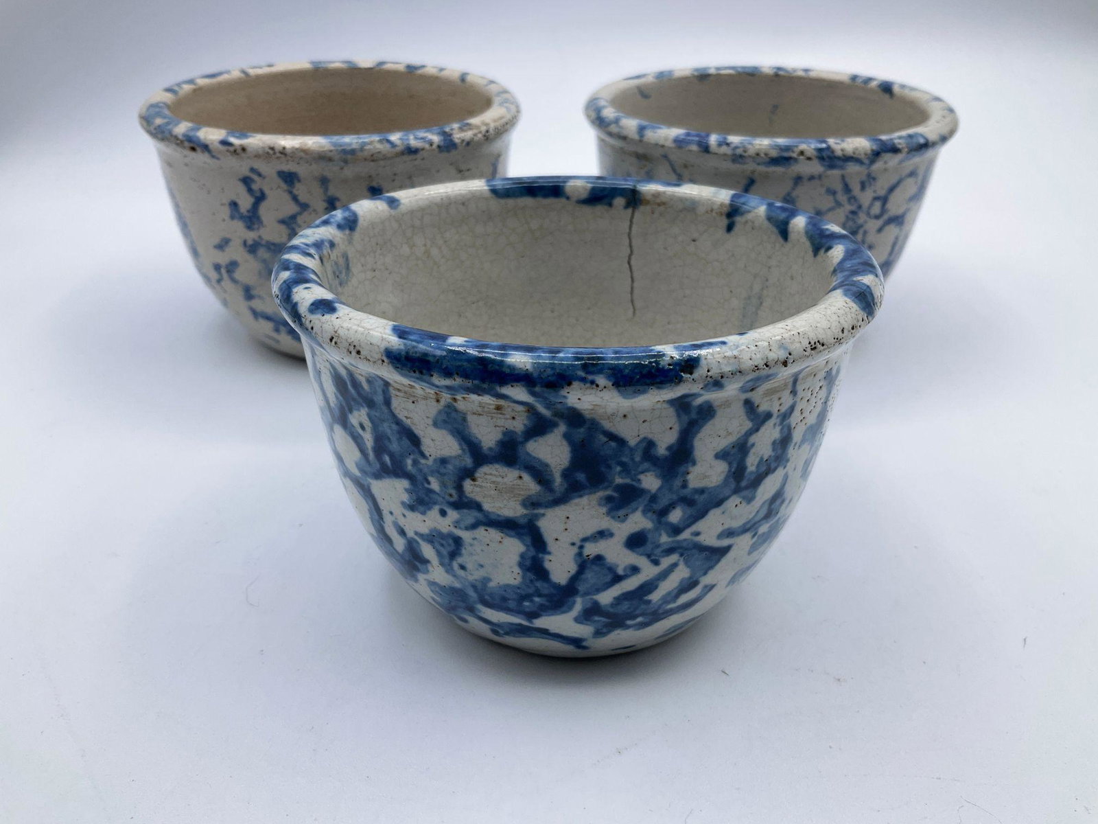 Three Blue Spongeware Custard Cups: Crazing and one with a 1.5 inch crack. 4.25 inches wide x 3 inches tall.
