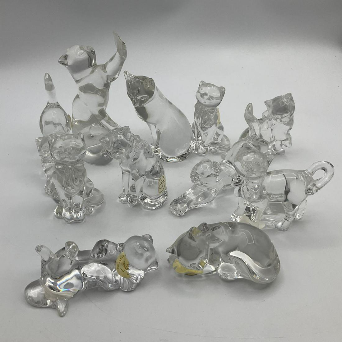 Lenox Crystal Cat Figurine Collection: Group of 11. Two of the cat stretching and two are of cat with bow. Others are unique. Good condition. Tallest is 5.75 ".