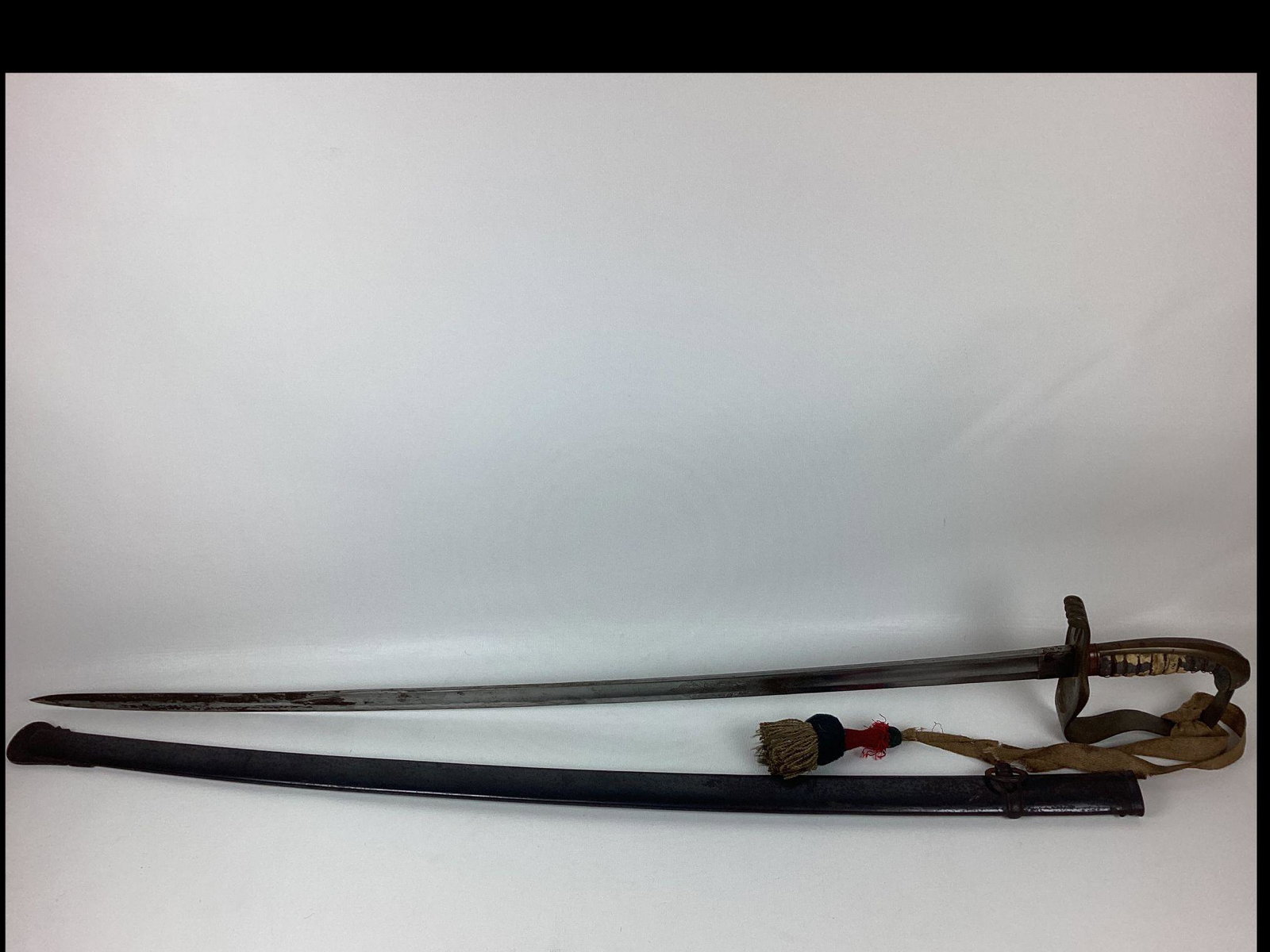 Pre WWI Bavarian Officers Saber with Rank Knot Unit Marked: Blade etched In Treue Fest and maker marked Clemen and Jung Solingen. Has dated stamp of 1898 on spine. Brass guard is marked 8 RE 4 2 on underside as well as scabbard. Rayskin grip is damaged. Knot h