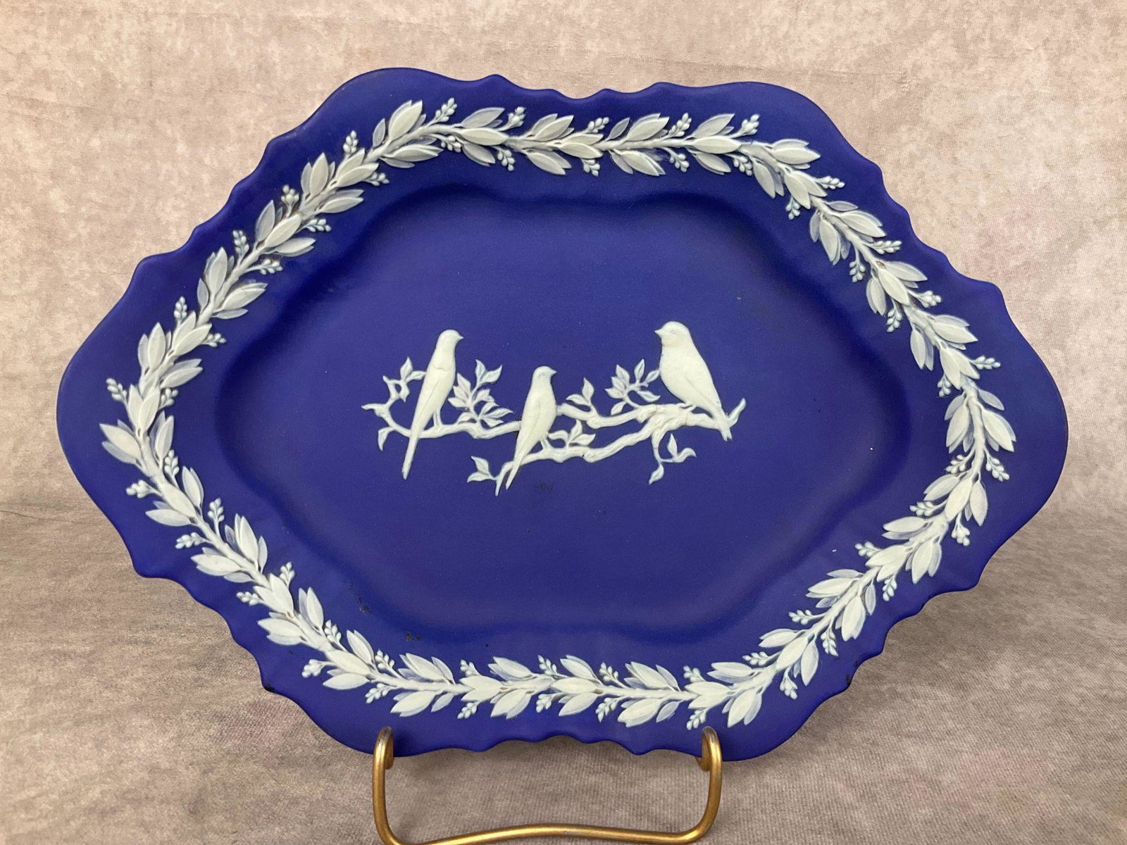 Wedgwood Blue Jasperware Tray: Caperns Birds pattern. From 1934. Some small areas of dark residue. Marked for Caperns Ltd, Bristol. 10.75 inches wide x 7.5 inches deep x 1.75 inches tall.