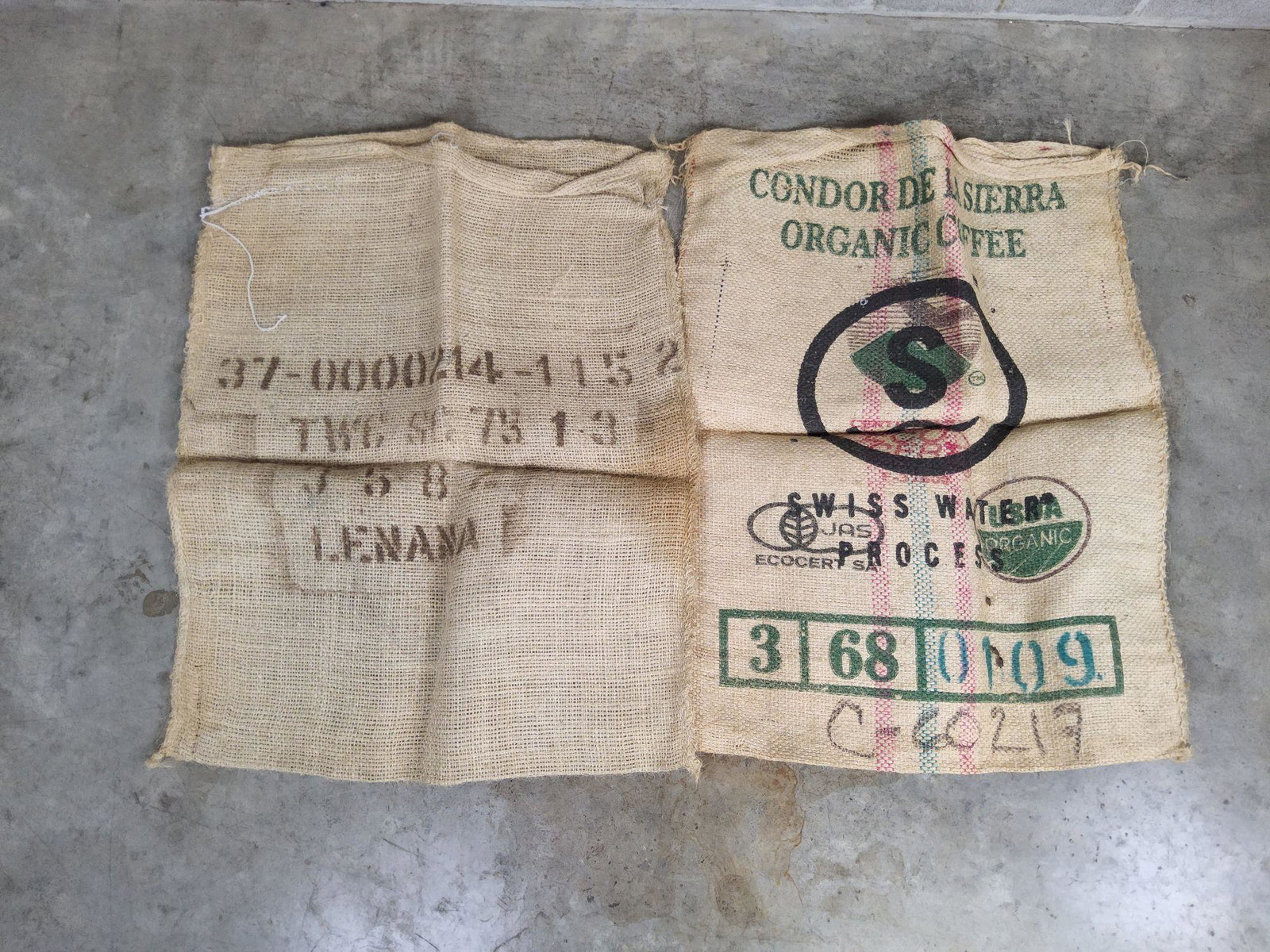 Two Burlap Coffee Bean Sacks: Wear from previous use. Measures approximately 28 x 37 inches.